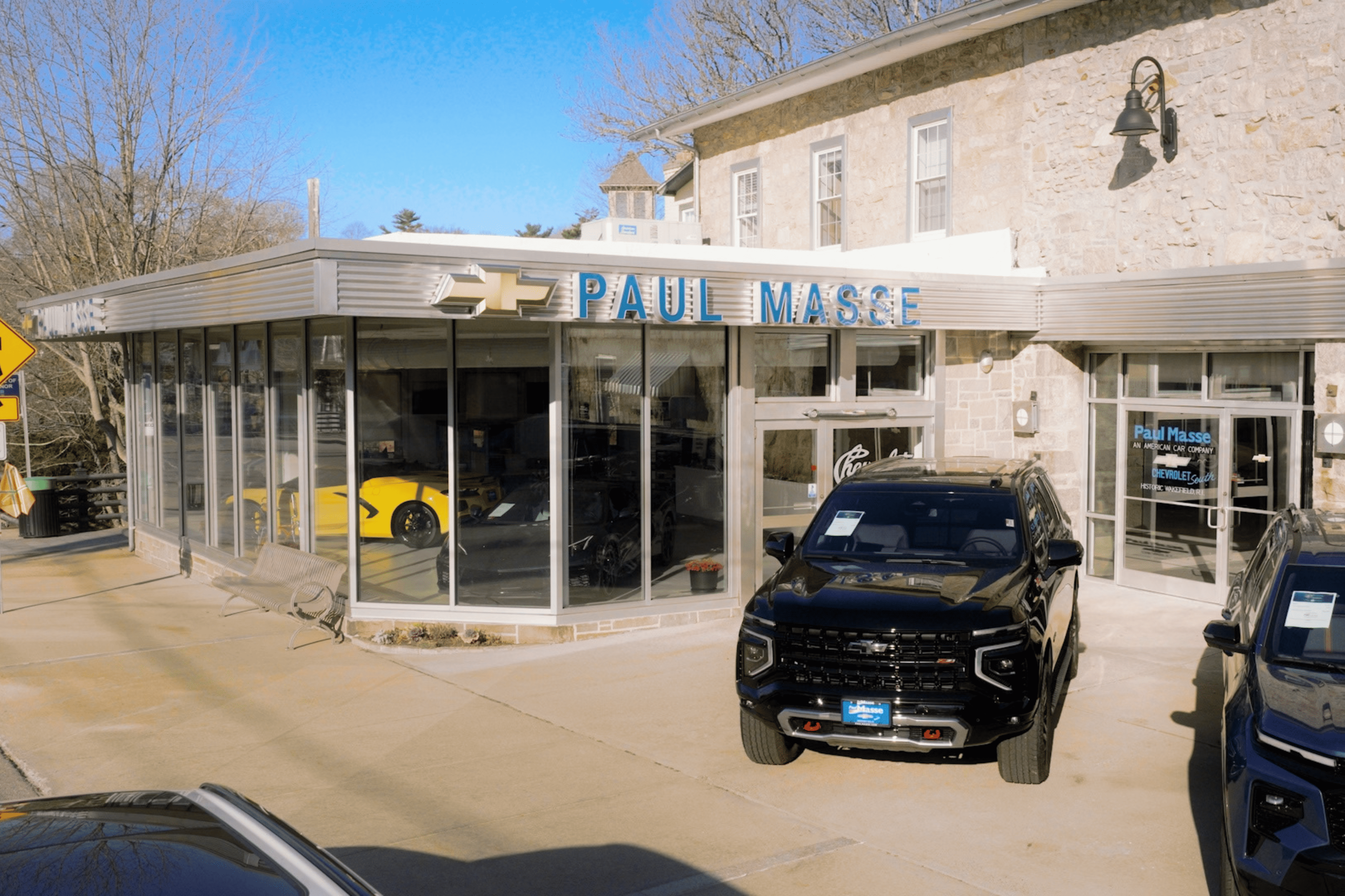 Paul Masse dealership in background with cars