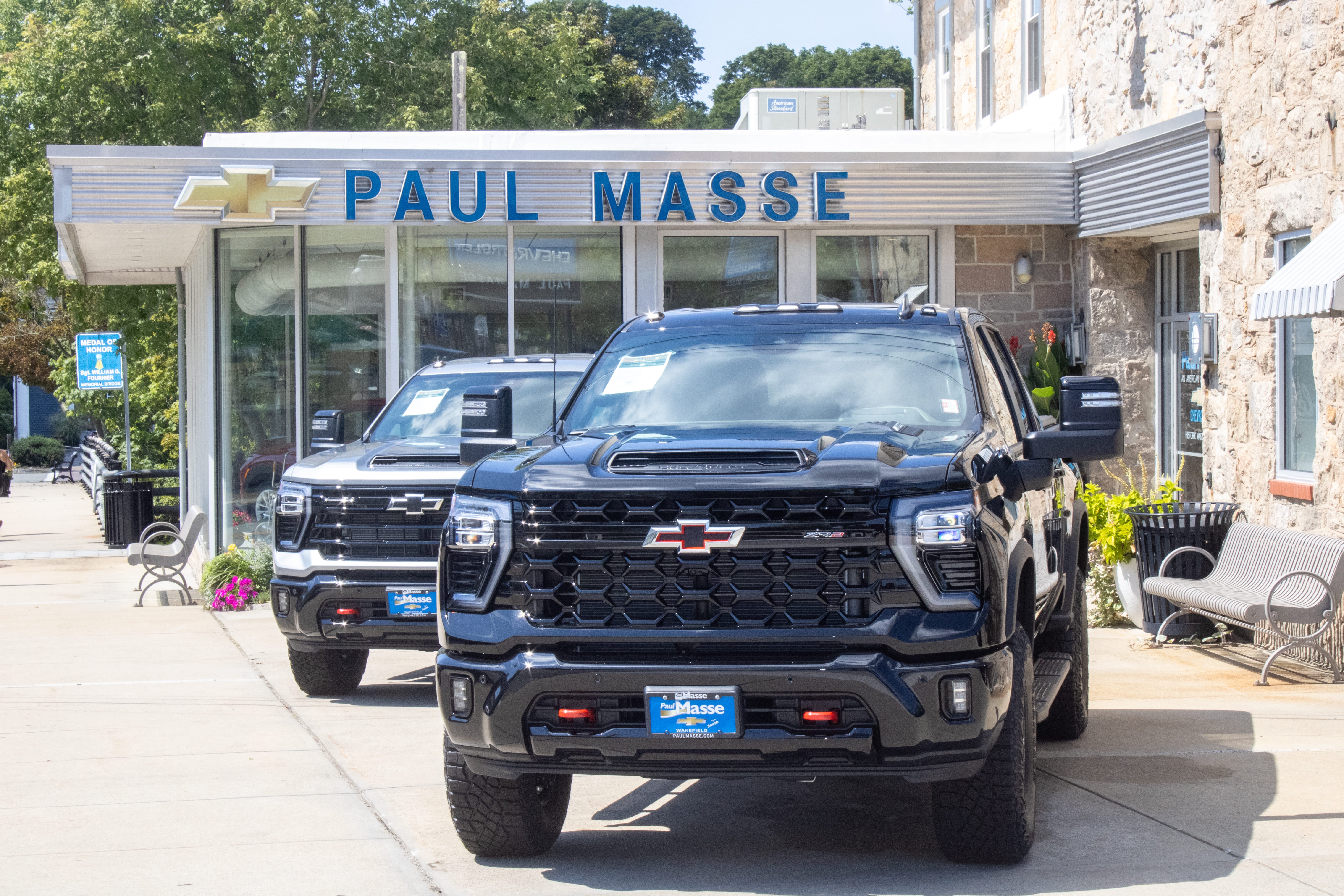 Paul Masse dealership in background with cars