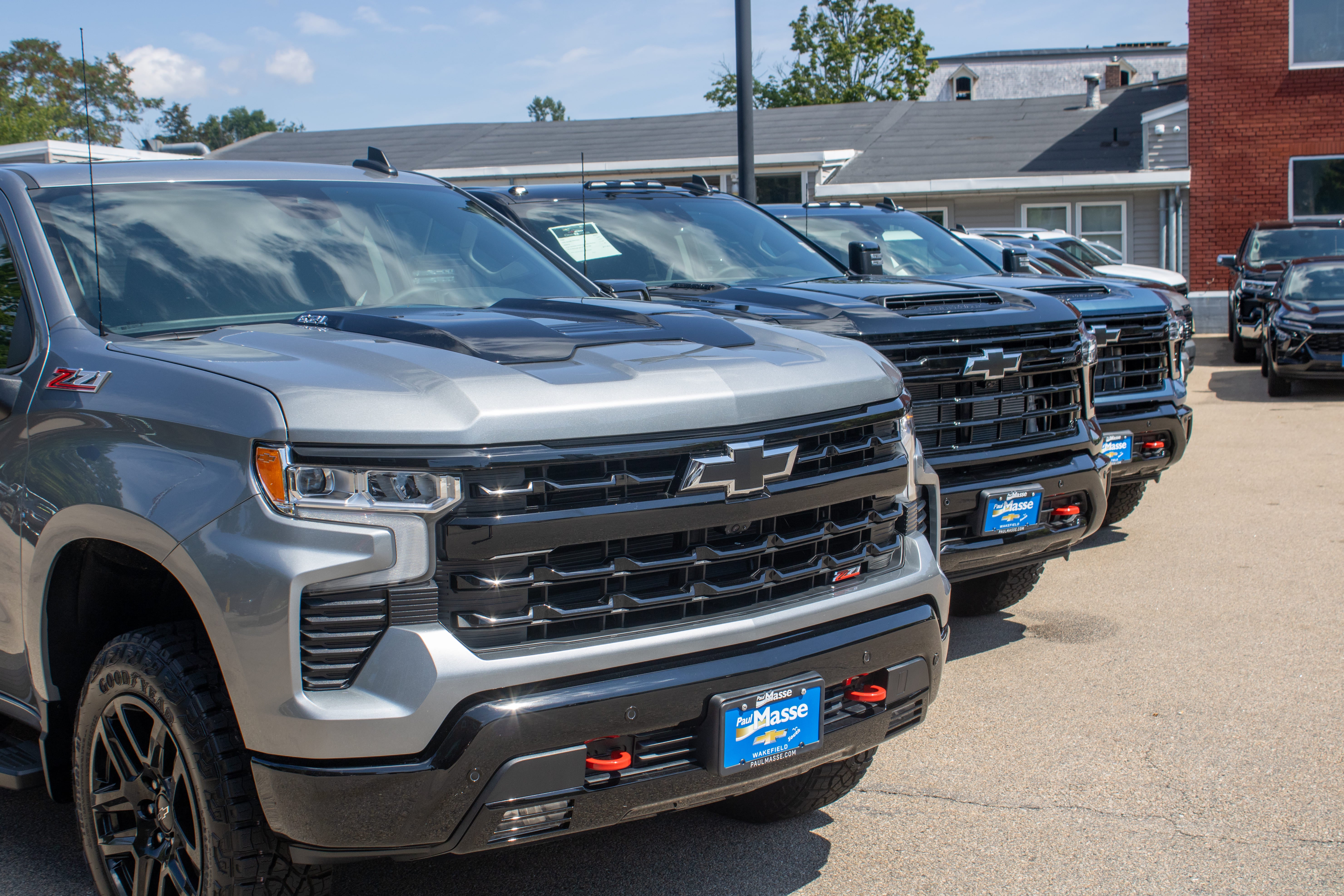 Paul Masse dealership in background with cars