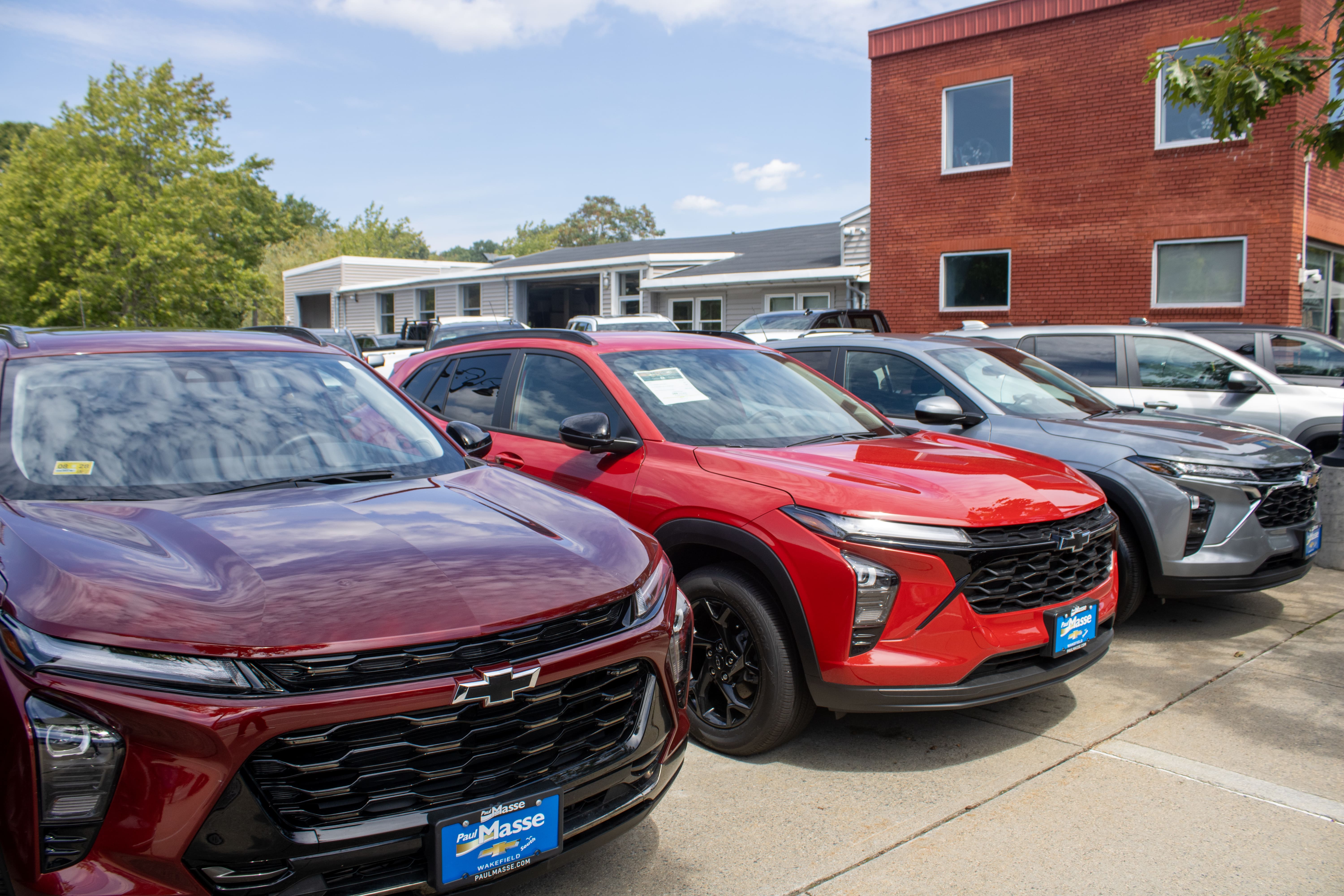 Paul Masse dealership in background with cars